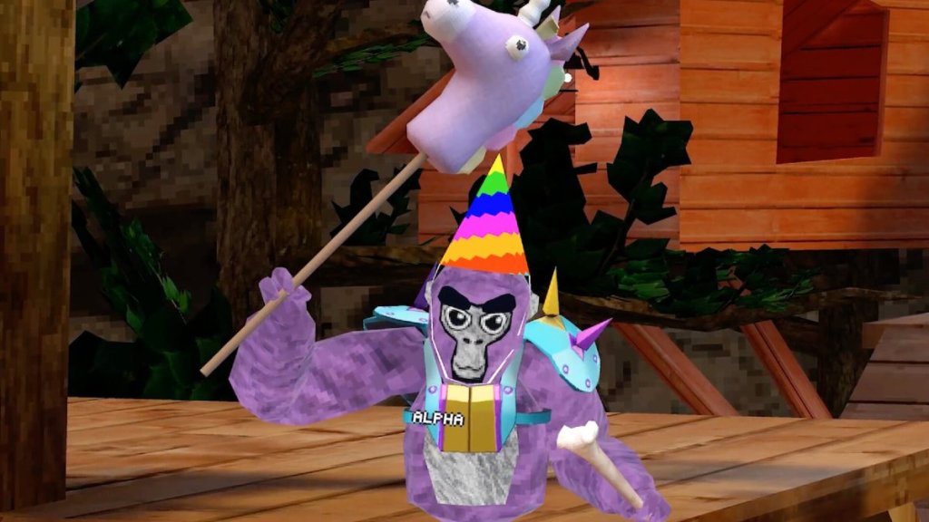 Un gorille violet portant un chapeau d'anniversaire